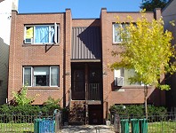 Two storeys (with basement), with squared-off façade and central entrance