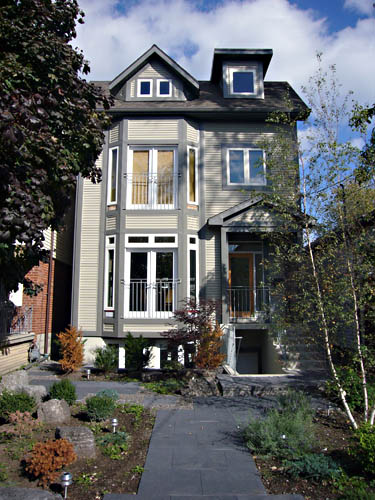 Three-storey house finished in siding